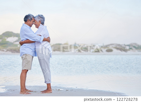 Senior couple retirement, beach holiday and travel vacation at sea with hug, love and care together. Elderly people in happy marriage, intimate hug and romantic relationship relax at ocean outdoor 122728278
