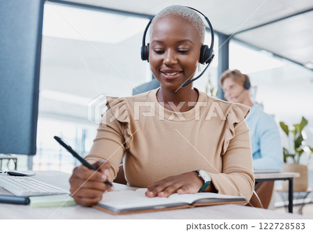 CRM, notebook and planning telemarketing consultant woman writing strategy, solution or idea with smile of success or motivation. Call center agent at desk for support, consulting and contact us 122728583