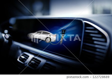 Electric car display screen that is showing the display of electric charging. 122728689