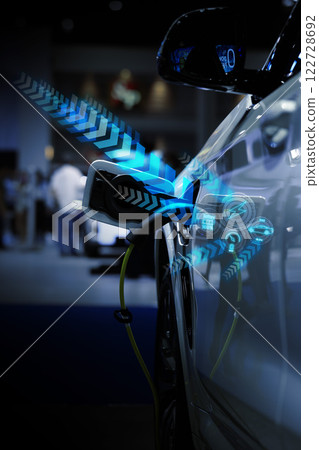 Power cable pump plug in charging power to electric vehicle EV car. 122728692