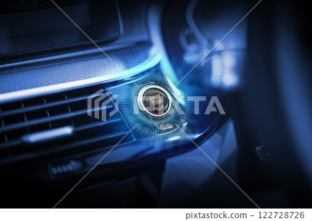 The car start button glows to indicate that it is ready to start. 122728726