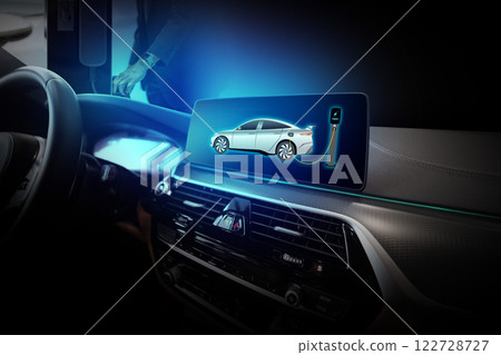 Electric car display screen that is showing the display of electric charging. 122728727