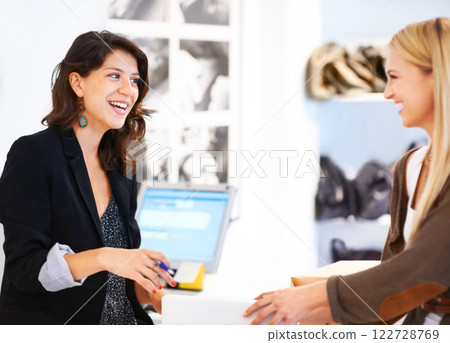 Fashion store cashier help customer with payment for shopping sale and discount deal at retail shop. Mall luxury boutique cash register sales assistant or service woman smile and helping happy girl Fashion store cashier help customer with payment for shopping sale and discount deal at retail shop. Mall luxury boutique cash register sales assistant or service woman smile and helping happy girl 122728769