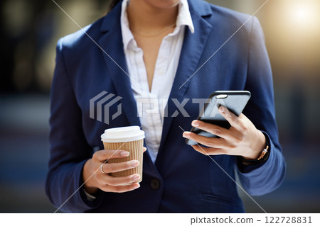 Coffee break and phone in hands of a business woman reading email, online internet notification or communication for contact us background. Corporate marketing professional worker with a cellphone Coffee break and phone in hands of a business woman reading email, online internet notification or communication for contact us background. Corporate marketing professional worker with a cellphone 122728831