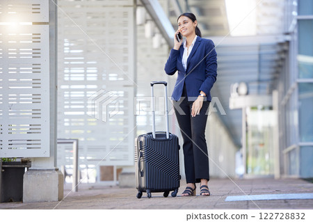 Travel business woman on phone call, communication for work and working with luggage at airport. Thinking corporate employee and worker speaking or talking on mobile and smartphone in hand with smile Travel business woman on phone call, communication for work and working with luggage at airport. Thinking corporate employee and worker speaking or talking on mobile and smartphone in hand with smile 122728832