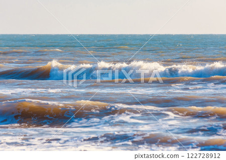 Strong waves in the sea during the winter morning in Thailand. Select a specific focus point. Strong waves in the sea during the winter morning in Thailand. Select a specific focus point. 122728912
