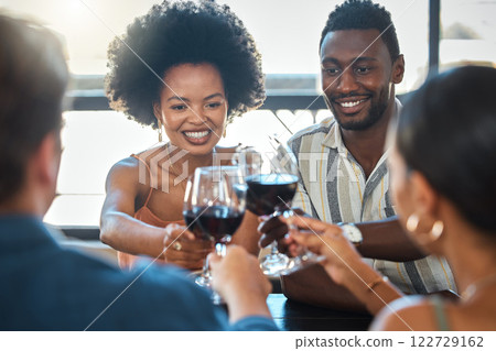 Cheers, celebrating and winning friends drinking wine together at a dinner celebration in a restaurant. Double date of loving and romantic couples dining and having fun on a weekend Cheers, celebrating and winning friends drinking wine together at a dinner celebration in a restaurant. Double date of loving and romantic couples dining and having fun on a weekend 122729162