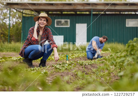 Agriculture, nature and sustainability farmer on phone call, working on farm with husband. Happy female talking to client about selling organic produce. Excited, success start of small green business Agriculture, nature and sustainability farmer on phone call, working on farm with husband. Happy female talking to client about selling organic produce. Excited, success start of small green business 122729257