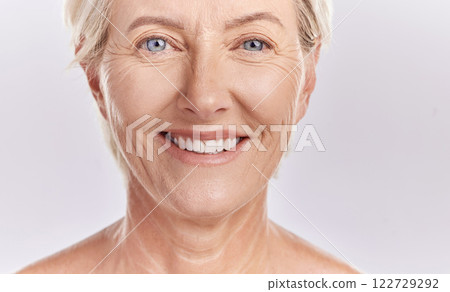 Portrait of a happy senior womans face against studio mockup background. Healthy and natural mature model with smooth skin. Feeling radiant and fresh with her healthcare or skincare cosmetic routine Portrait of a happy senior womans face against studio mockup background. Healthy and natural mature model with smooth skin. Feeling radiant and fresh with her healthcare or skincare cosmetic routine 122729292