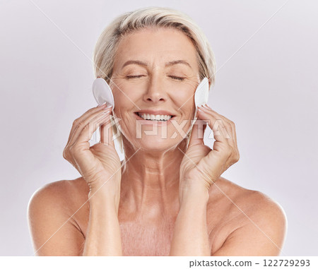 Face of senior with facial cleaning beauty and skincare cotton makeup cosmetic for healthy skin. Self care and happy elderly woman or person smile with cosmetics for skin care wellness treatment 122729293