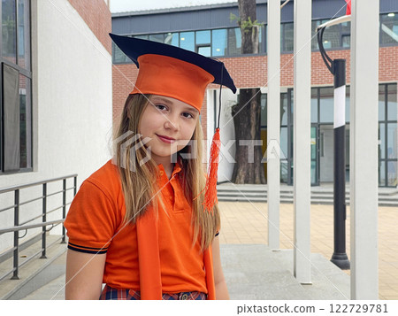 Proud elementary school graduate, little girl student portrait 122729781