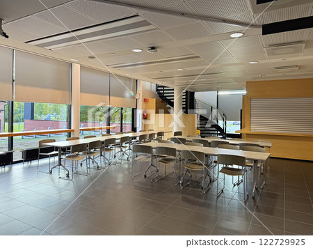 Modern Office Or Cafe Interior With Table, Chairs, Waiting Area and Staircase Modern Office Or Cafe Interior With Table, Chairs, Waiting Area and Staircase 122729925