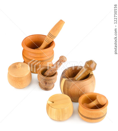 Set of wooden mortars and pestles isolated on white background. Free space for text. Collage. Set of wooden mortars and pestles isolated on white background. Free space for text. Collage. 122730556