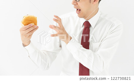 Man holding hamburger Man holding hamburger 122730821