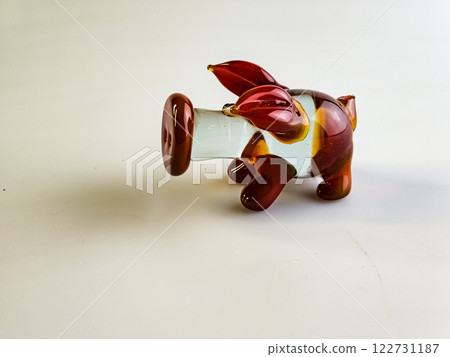 Glass figurine of a pig on a white background Glass figurine of a pig on a white background 122731187