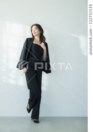 Middle-aged woman in a black suit 122731519