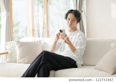 A man operating a smartphone 122731987