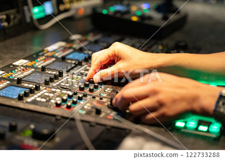 A man working at a TV station A man working at a TV station 122733288