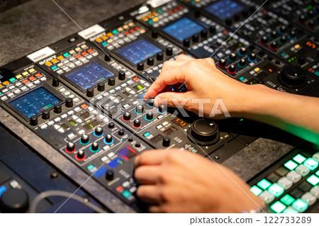 A man working at a TV station A man working at a TV station 122733289