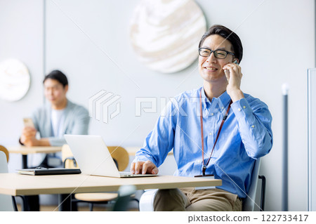 Business person who operates a smartphone 122733417