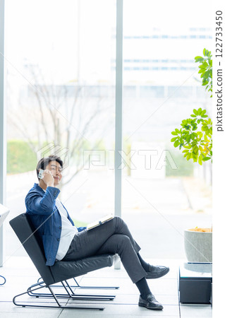 Businessmen working in the lobby Businessmen working in the lobby 122733450