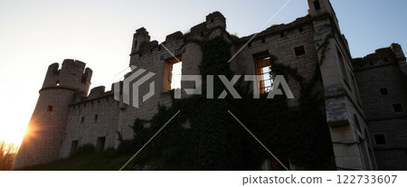 Medieval castle at sunset. Panoramic view of medieval castle at sunset. 122733607