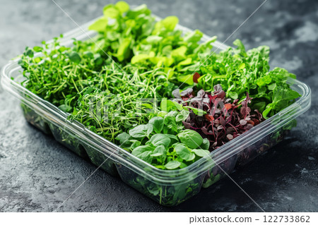 Fresh organic herbs in a plastic container from a local market 122733862