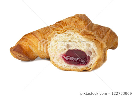 French croissant with cherry jam filling isolated on the white background French croissant with cherry jam filling isolated on the white background 122733969