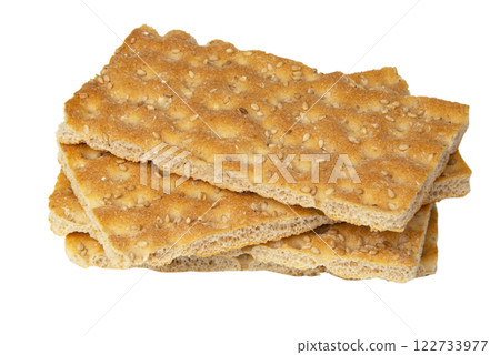 Many crispbread with sesame seeds isolated on the white background Many crispbread with sesame seeds isolated on the white background 122733977