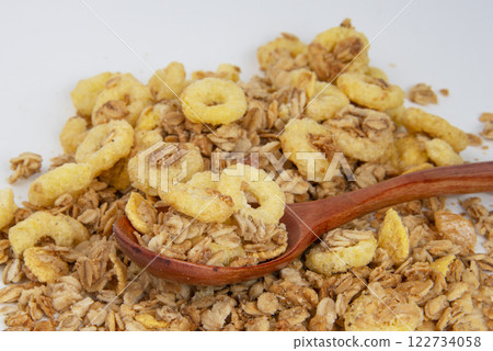 Oatmeal cereal breakfast in wooden spoon textured background Oatmeal cereal breakfast in wooden spoon textured background 122734058