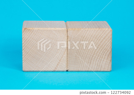 Empty clear wooden cube on blue background 122734092