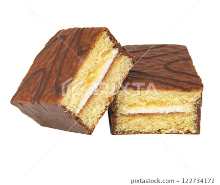 Biscuit cake with cream filling glazed chocolate isolated on the white Biscuit cake with cream filling glazed chocolate isolated on the white 122734172