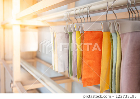 Set of colorful fabric swatch material. Various color and texture upholstery sample collection 122735193
