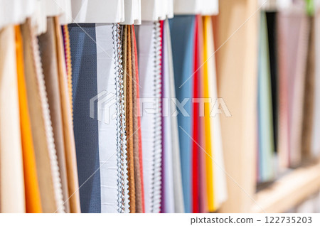 Set of colorful fabric swatch material collection. Various color and texture sample fabric pieces 122735203