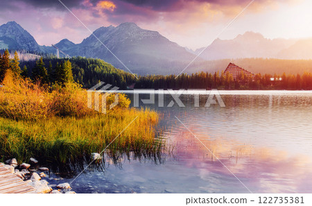 Majestic mountain lake in National Park High Tatra. Strbske pleso, Slovakia, Europe. Majestic mountain lake in National Park High Tatra. Strbske pleso, Slovakia, Europe. 122735381