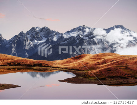 Sunset on mountain lake Koruldi. Upper Svaneti, Georgia Europe. Caucasus mountains Sunset on mountain lake Koruldi. Upper Svaneti, Georgia Europe. Caucasus mountains 122735437