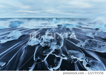 Jokulsarlon glacier lagoon, fantastic sunset on the black beach, Iceland 122735556