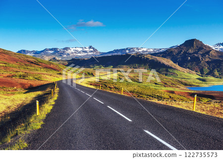 Asphalt road to the mountains Iceland. Beauty world 122735573