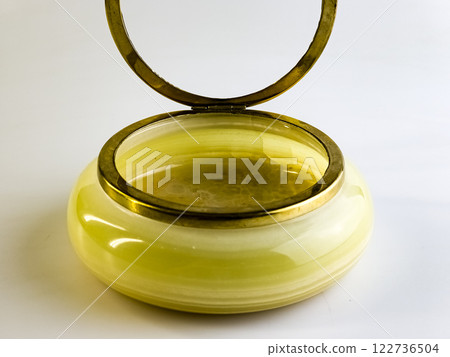 Luxurious jewelry box made of natural onyx on a white background. 122736504