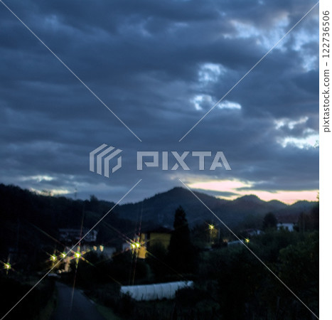 house with lights at dawn 122736506
