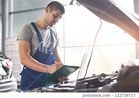Picture showing muscular car service worker repairing vehicle Picture showing muscular car service worker repairing vehicle 122736557