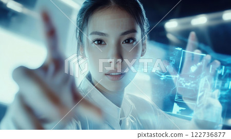 Asian woman interacting with futuristic holographic interface in a high-tech environment for innovative digital solutions Asian woman interacting with futuristic holographic interface in a high-tech environment for innovative digital solutions 122736877