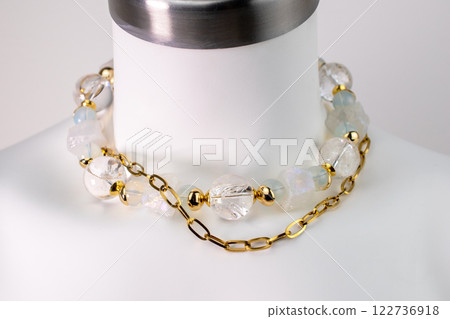 Unique necklace on a white mannequin, promotional photo for an online vintage and handmade jewelry store 122736918