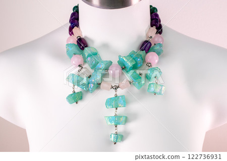 Unique necklace on a white mannequin, promotional photo for an online vintage and handmade jewelry store 122736931