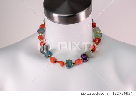 Unique necklace on a white mannequin, promotional photo for an online vintage and handmade jewelry store 122736934