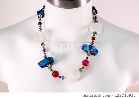 Unique necklace on a white mannequin, promotional photo for an online vintage and handmade jewelry store Unique necklace on a white mannequin, promotional photo for an online vintage and handmade jewelry store 122736935