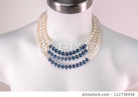 Unique necklace on a white mannequin, promotional photo for an online vintage and handmade jewelry store Unique necklace on a white mannequin, promotional photo for an online vintage and handmade jewelry store 122736936