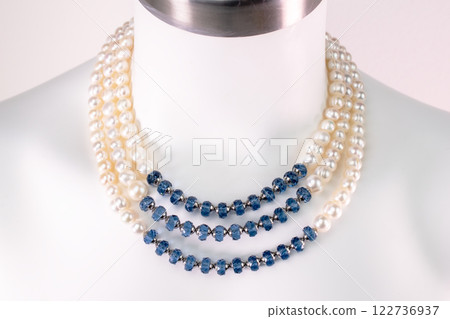 Unique necklace on a white mannequin, promotional photo for an online vintage and handmade jewelry store Unique necklace on a white mannequin, promotional photo for an online vintage and handmade jewelry store 122736937