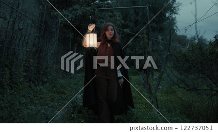 Mysterious Woman Walks Among Trees For Religious Rite In Abandoned House Night 122737051