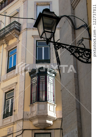 Facade of an old house with a bay window, European historical buildings, Lisbon, Portugal Facade of an old house with a bay window, European historical buildings, Lisbon, Portugal 122737811